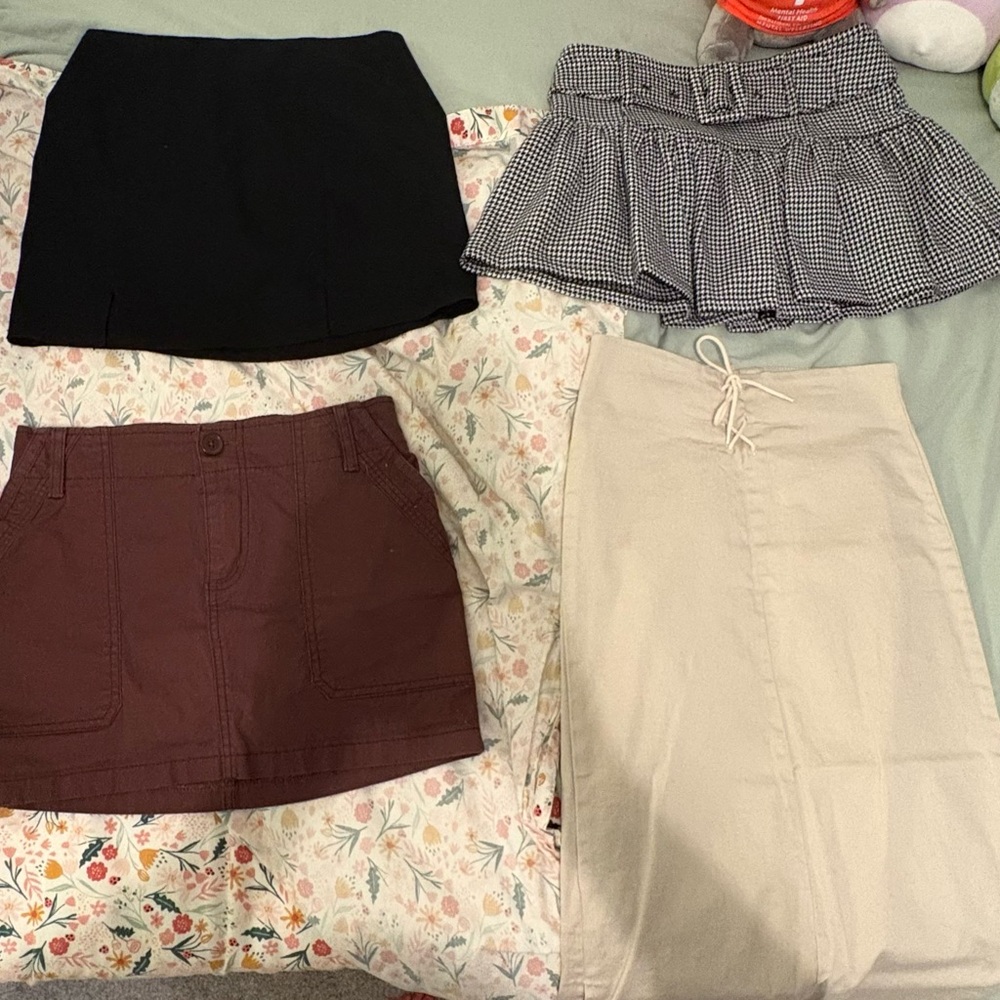 Set of Four Skirts in Black, Checkered, Brown, and Beige